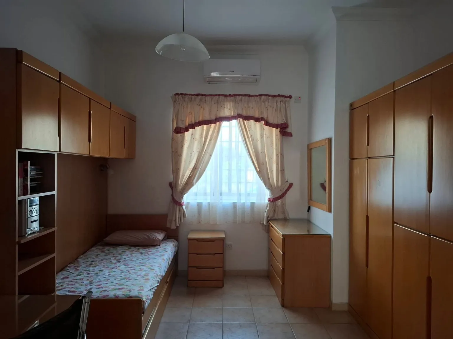 Furnished room available on a Housing Authority registered lease at the Gudja villa
